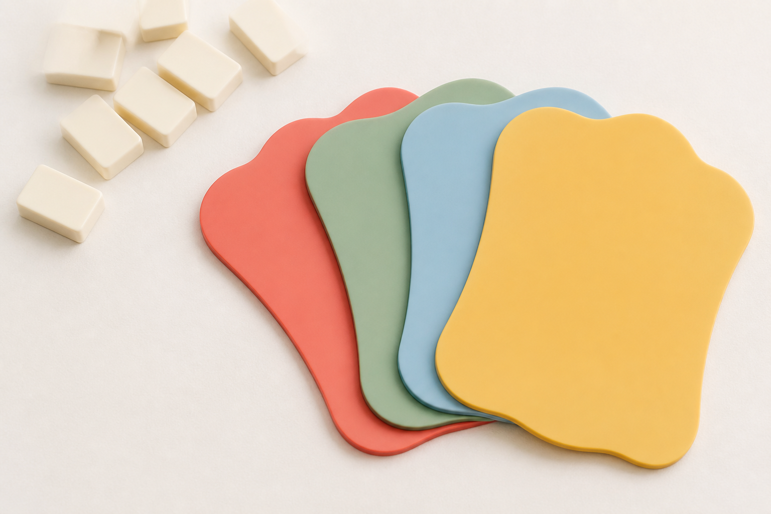 Four coordinated custom Mahjong shuffler cards arranged beside face-down tiles for a retail product-planning guide